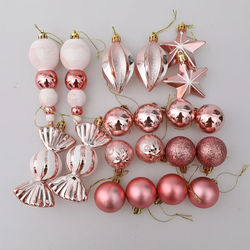 Collection of pink and rose gold Christmas ornaments.