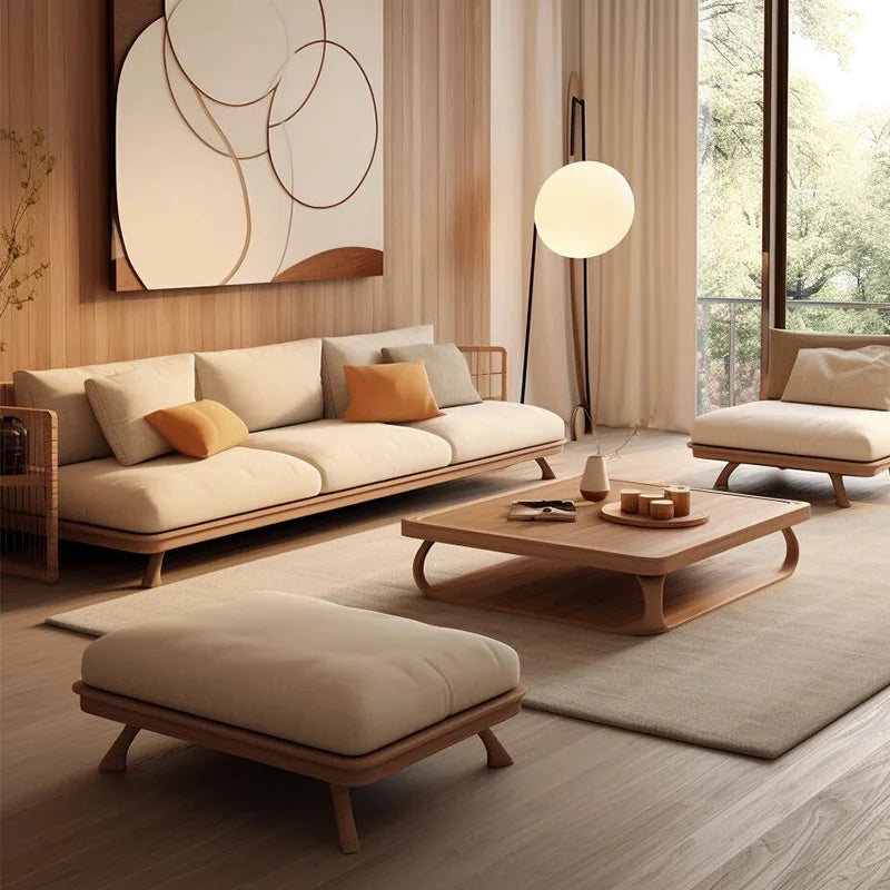 Modern living room beige sofa, ottoman, and coffee table.