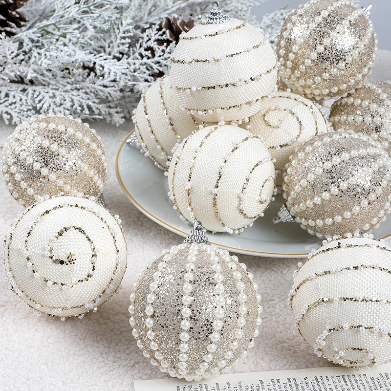 Decorative Christmas balls with silver and white ribbons on a textured surface.